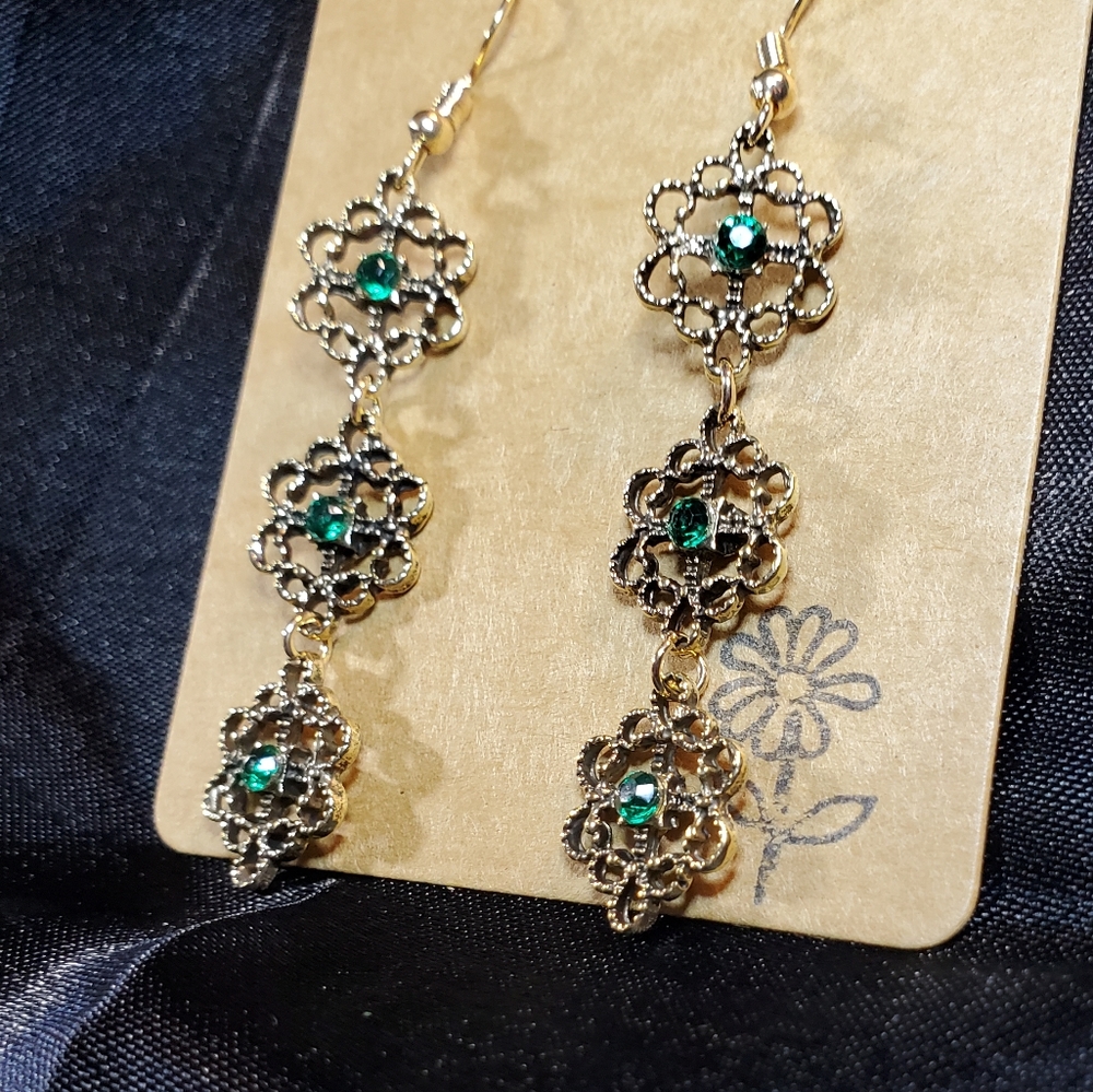 Gorgeous gold dangling earrings, 3 tier with dark green stones.